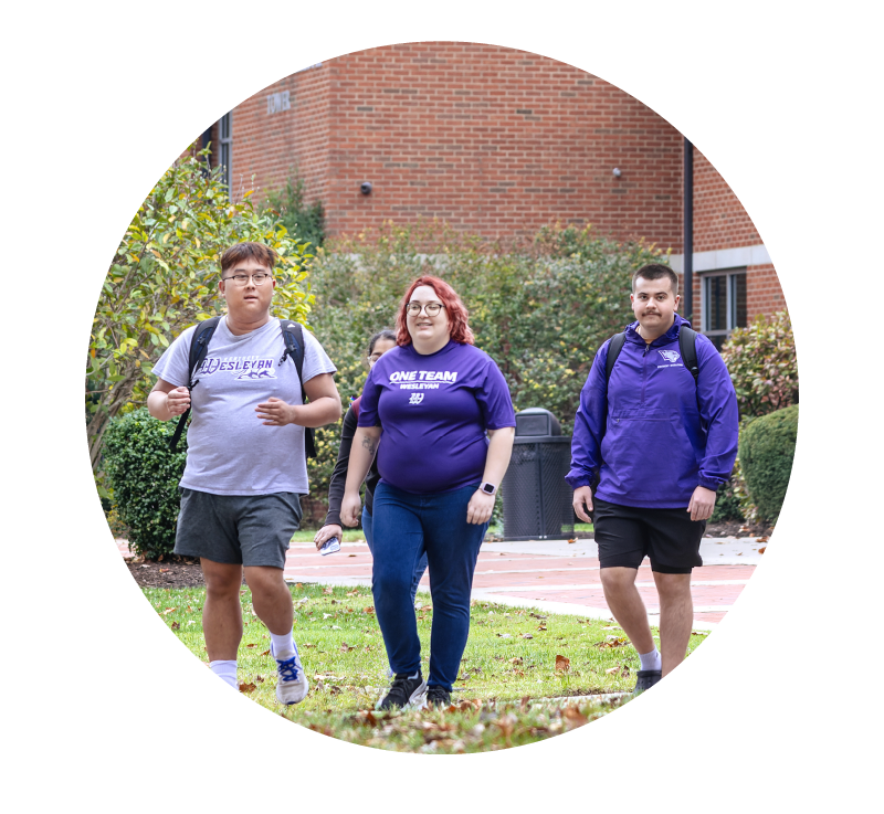 image of college students walking together across campus | Higher Ed Marketing & Student Search Services | enrollmentFUEL