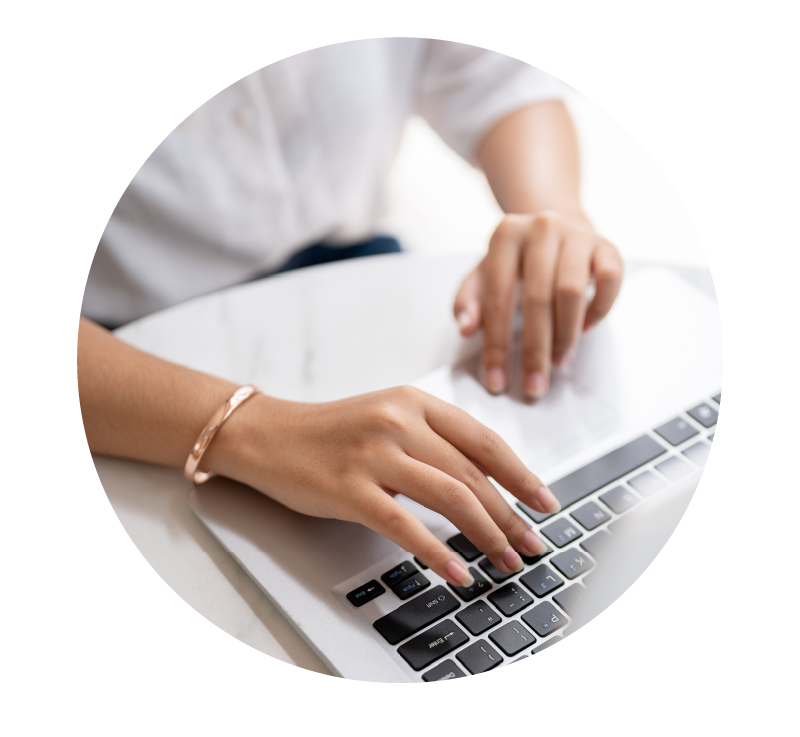 Image of person using a laptop | Higher Ed Marketing & Student Search Services | enrollmentFUEL