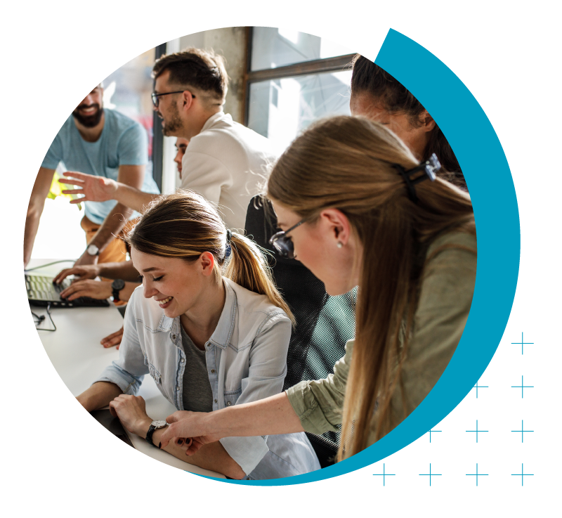 Higher Ed Marketing & Student Search Services | enrollmentFUEL | image of professionals collaborating around a table and computer